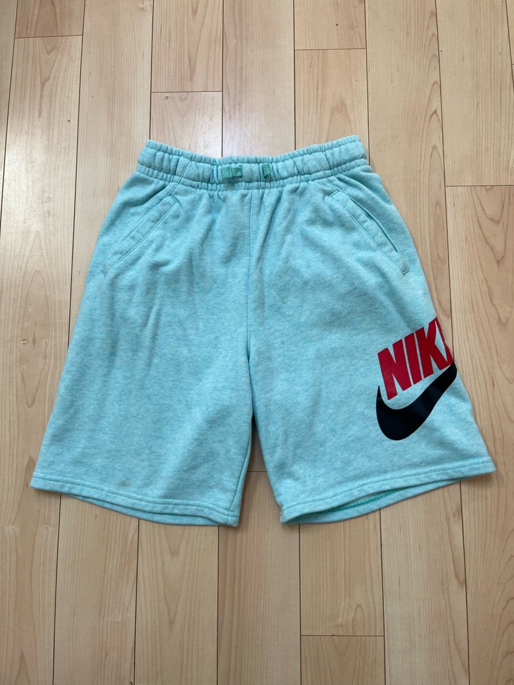 Nike Kids Light Aqua Shorts with Red & Black Logo